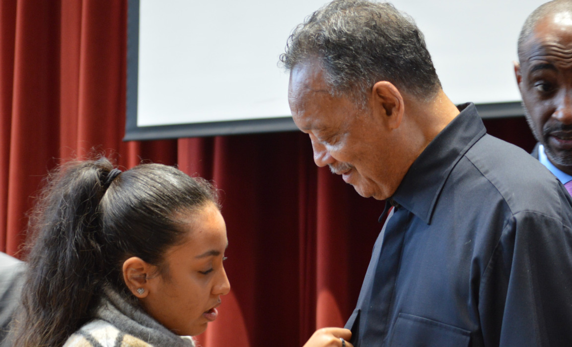 Jasmine Rajan presents Rev Jackson with Bancroft's Community Colours (Photo: Bancroft's School)