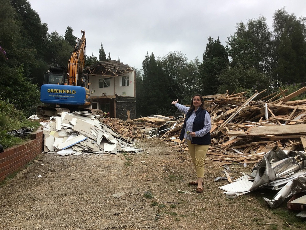 Mrs Skrine in front of the demolished Head's House