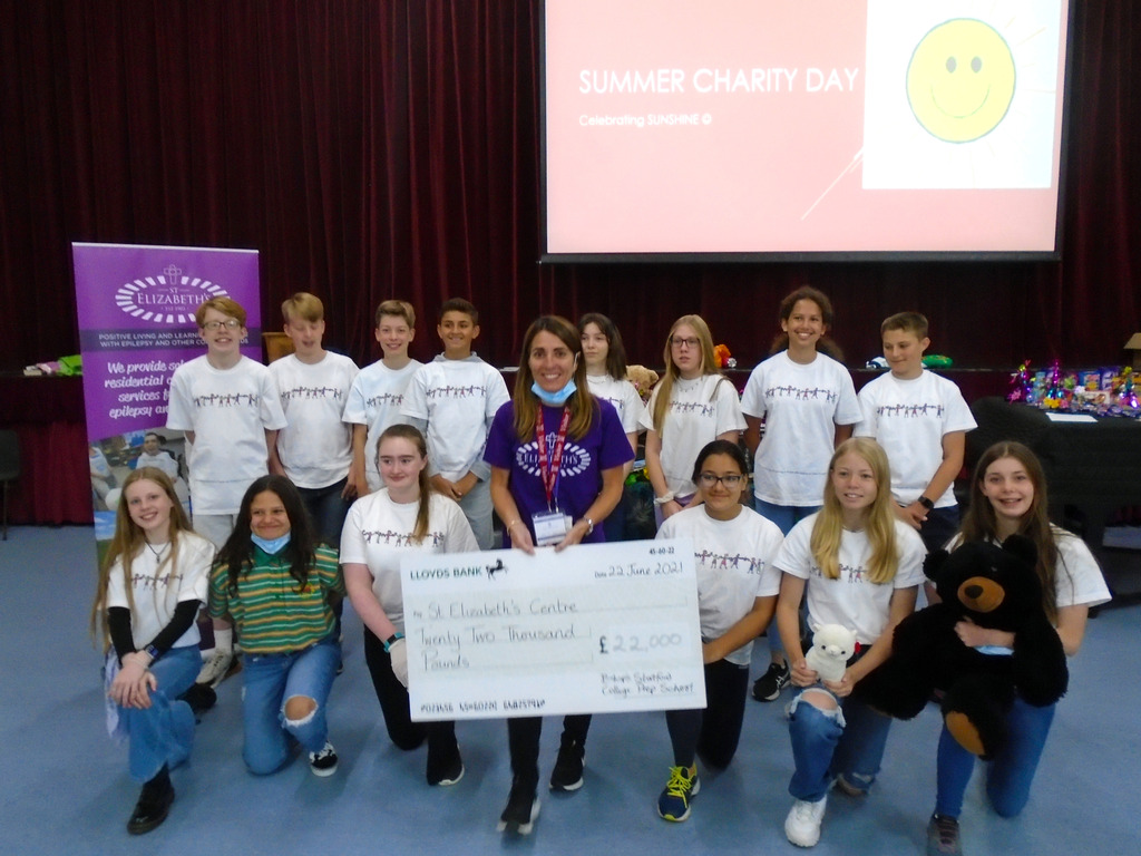 Bishop's Stortford College Prep School Prefects present cheque to Kat from St Elizabeth's Centre
