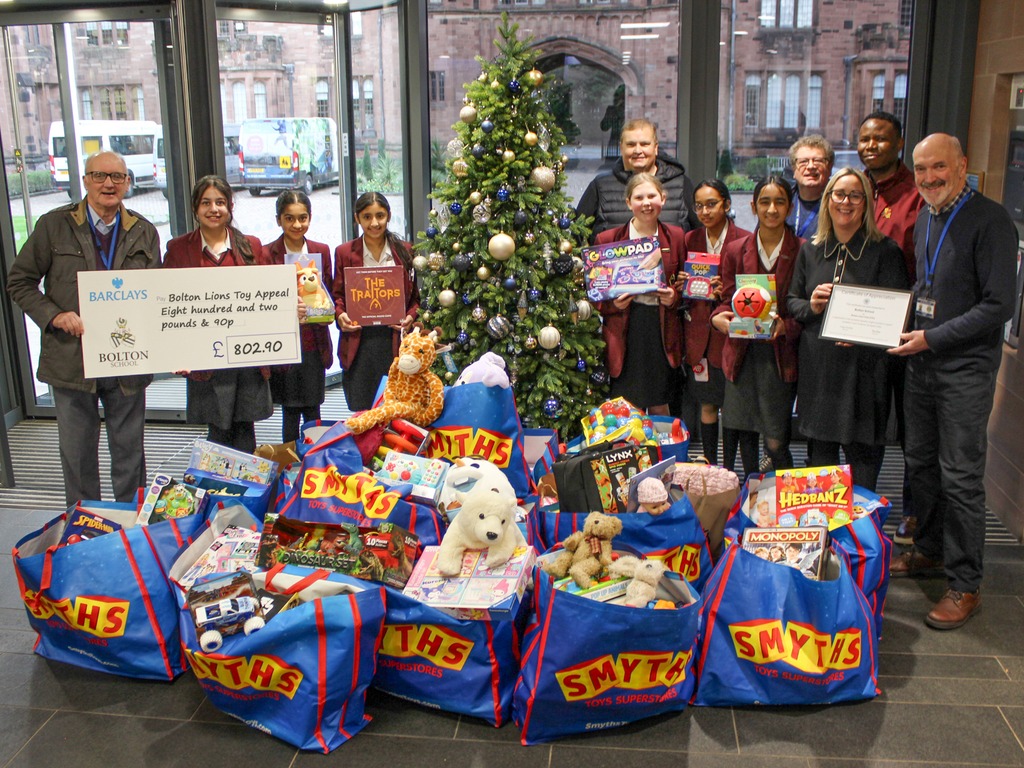 Girls’ Sponsored Silence Funds Donation to Bolton Lions Toy Appeal