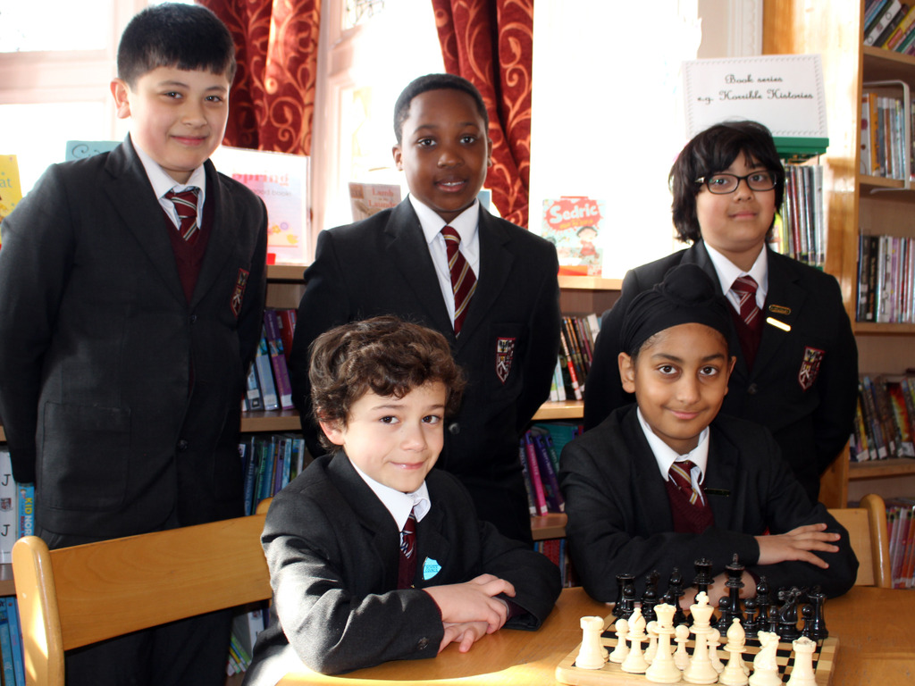 Brentwood Prep Online Chess - left-right (standing) Max Jaden Yahya (sitting) Markos Dilsher Year 6 Bubble