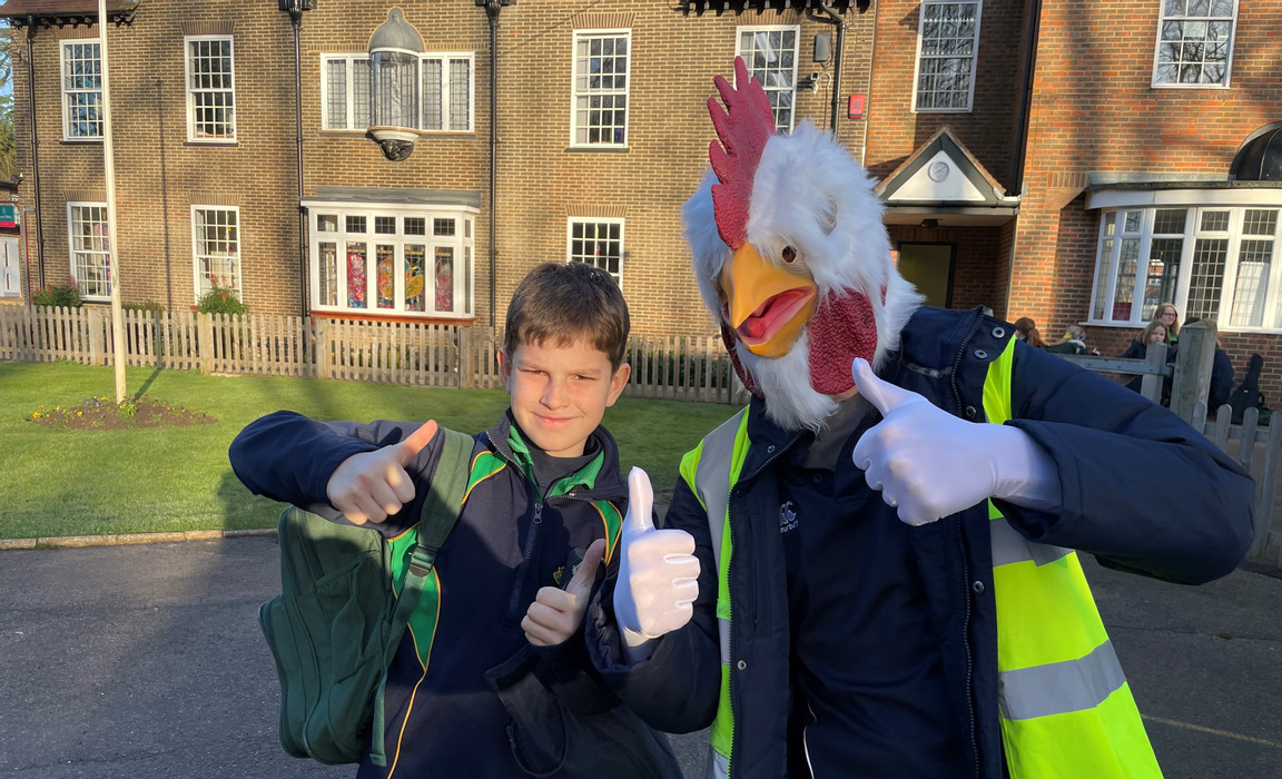 Cornelius greeting pupils who walk to school (Photo: Chinthurst School)