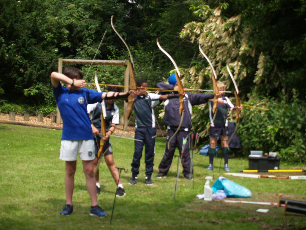 Derby Grammar School pupils practicing archery on the lawns