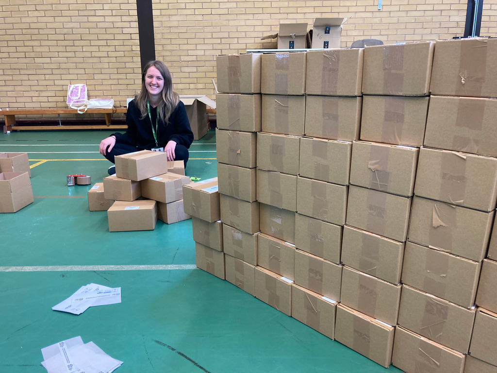KEHS PE Staff member packing care boxes