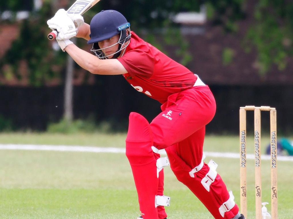 Hugo playing cricket for Lancashire
