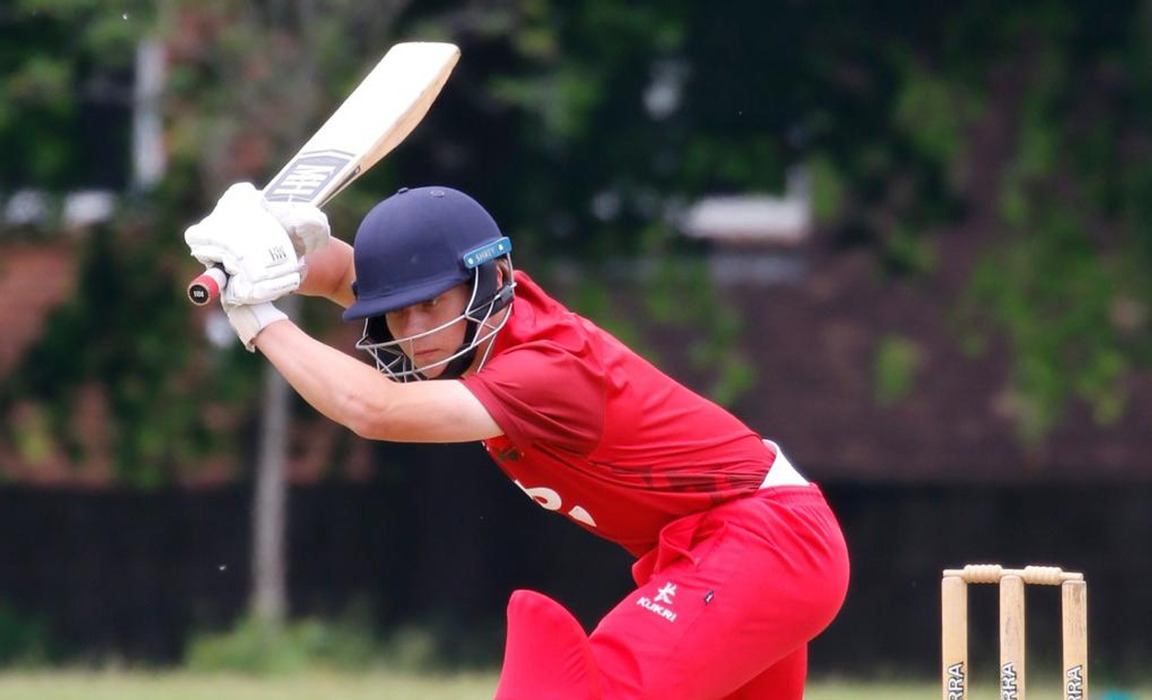 Hugo playing cricket for Lancashire