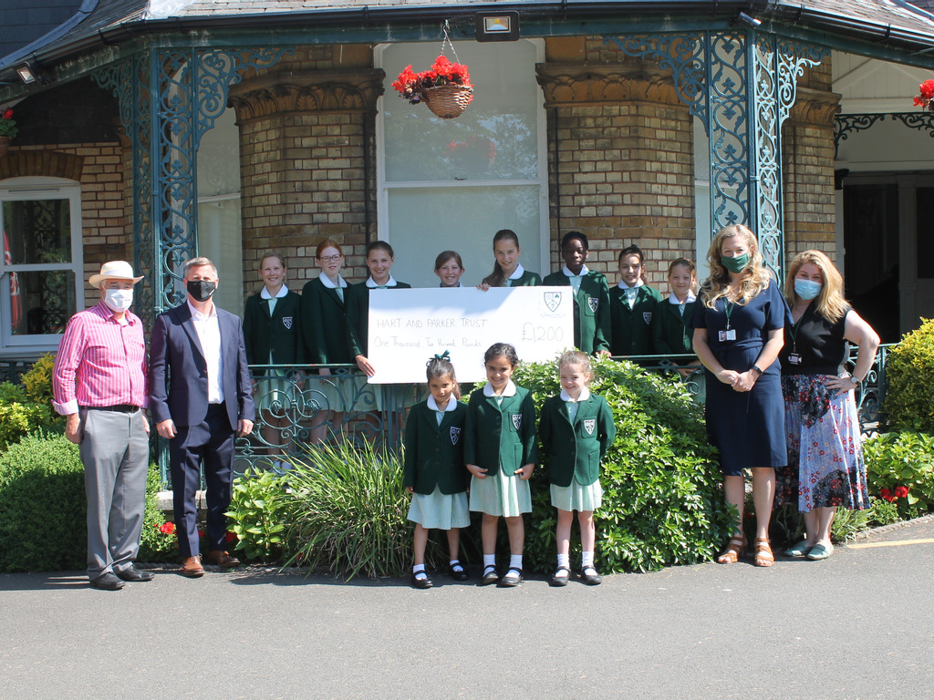 Presentation of £1,200 raised for Hart and Parker Trust