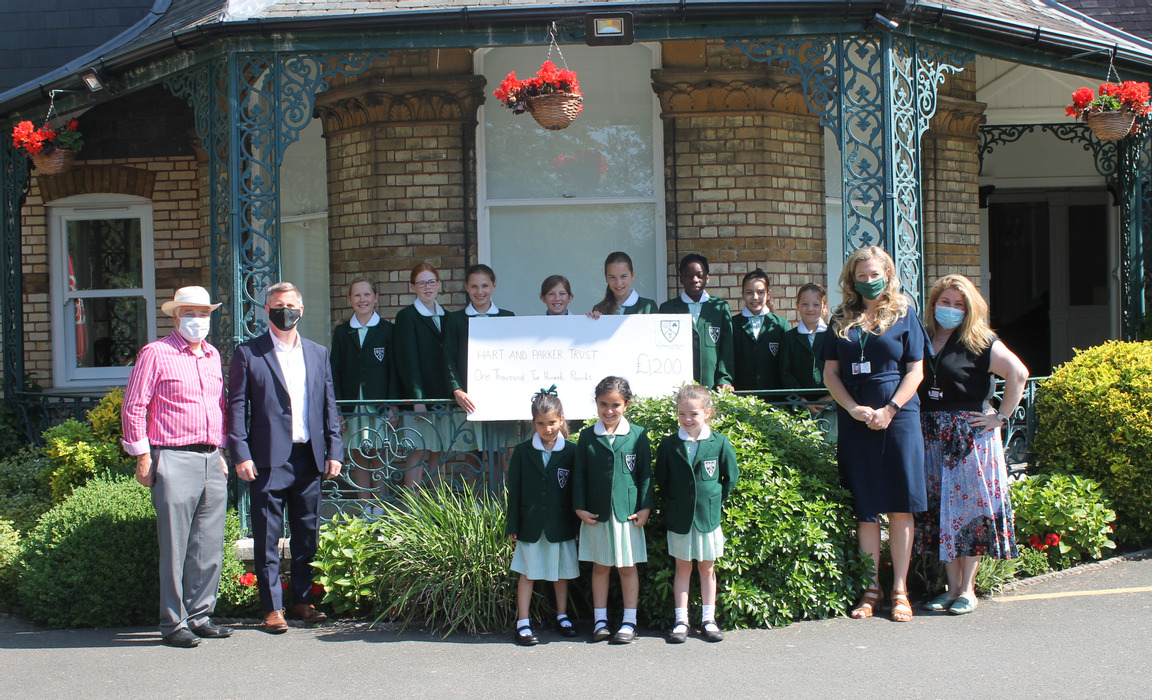 Presentation of £1,200 raised for Hart and Parker Trust