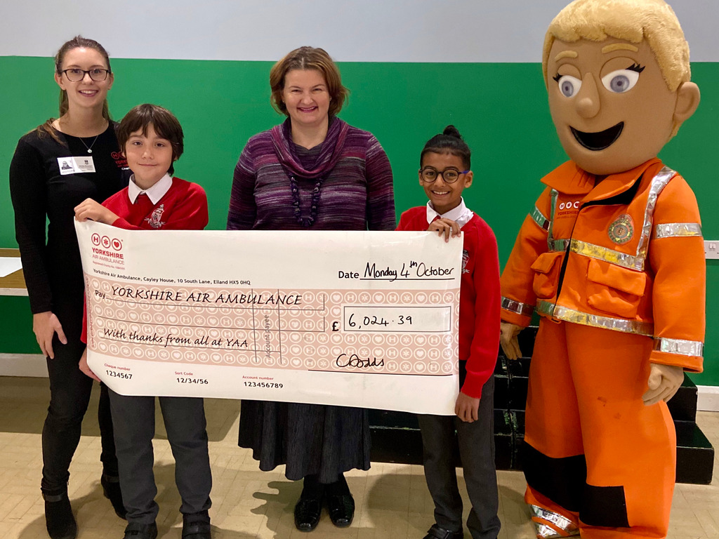 (LtoR) Vickie Bowden from YAA, Headteacher of The Froebelian School Catherin Dodds and Polly the Paramedic with The Froebelian Charity Captains.jpeg
