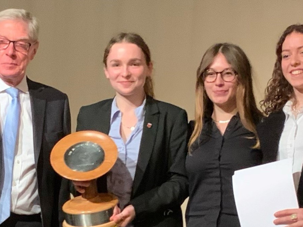 The winning team with their trophy