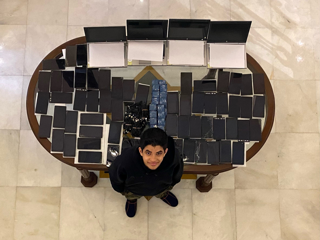 Ishan Kapur with the digital devices he collected