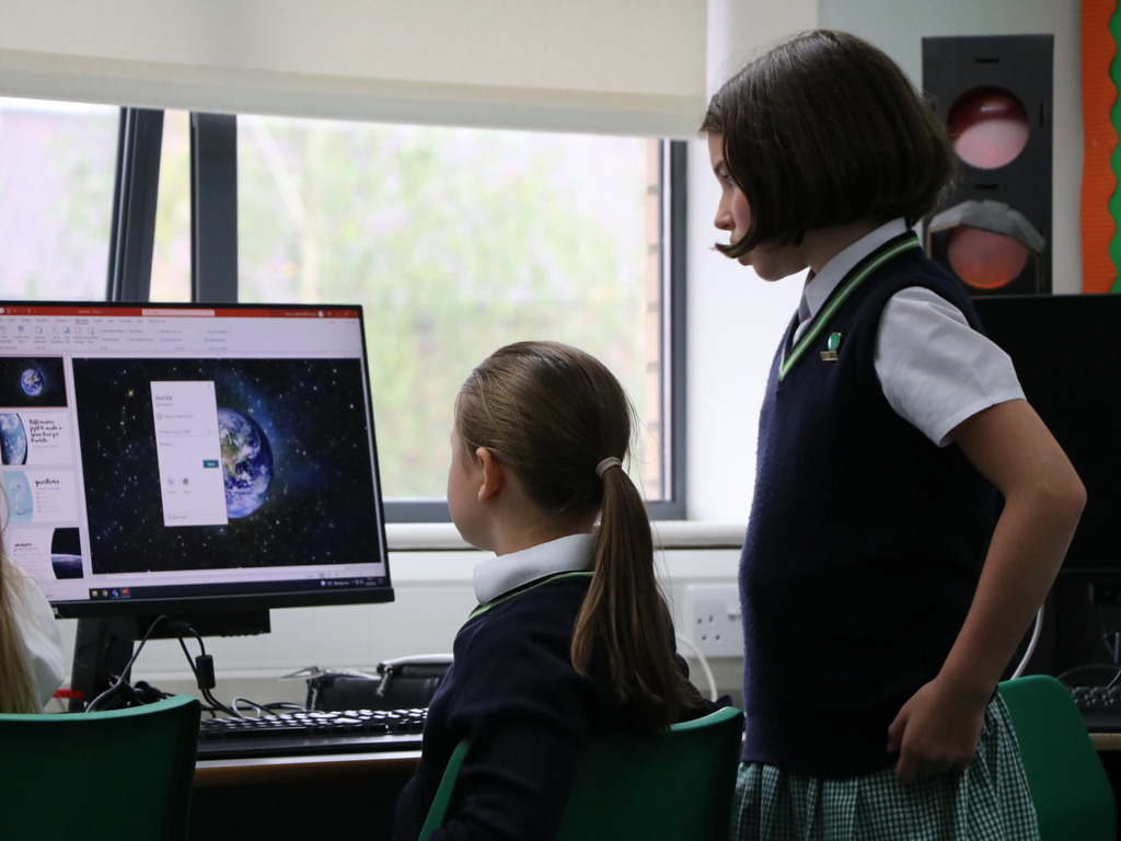 Year 5 working on a PowerPoint