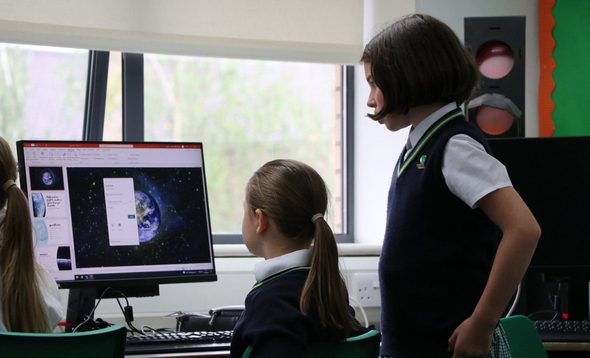 Year 5 working on a PowerPoint